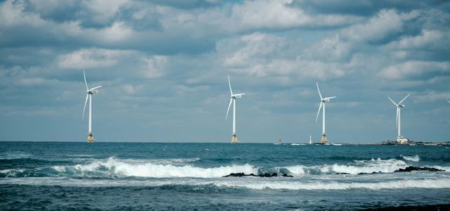 white sail boat on sea during daytime