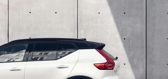 white SUV parked on road