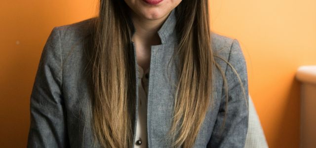 woman looking at MacBook