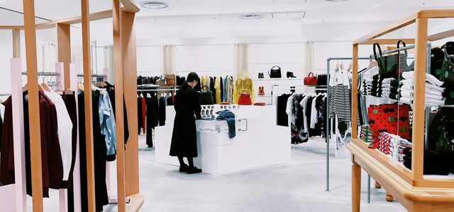 woman standing inside clothing area