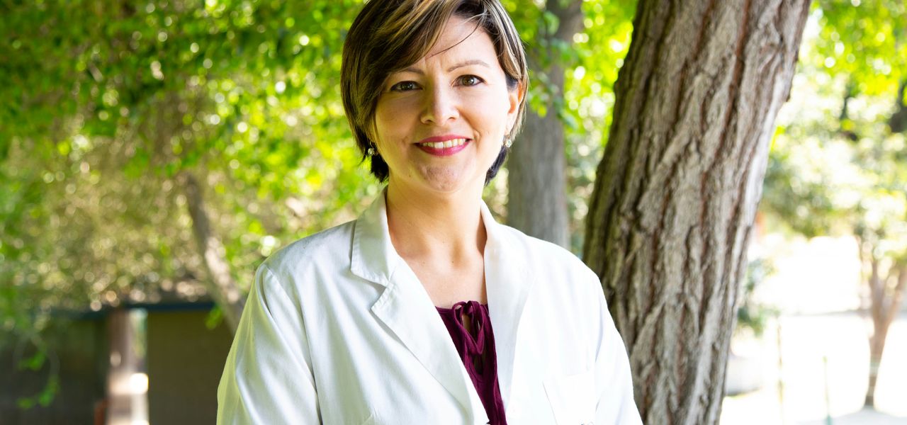 woman standing under tree