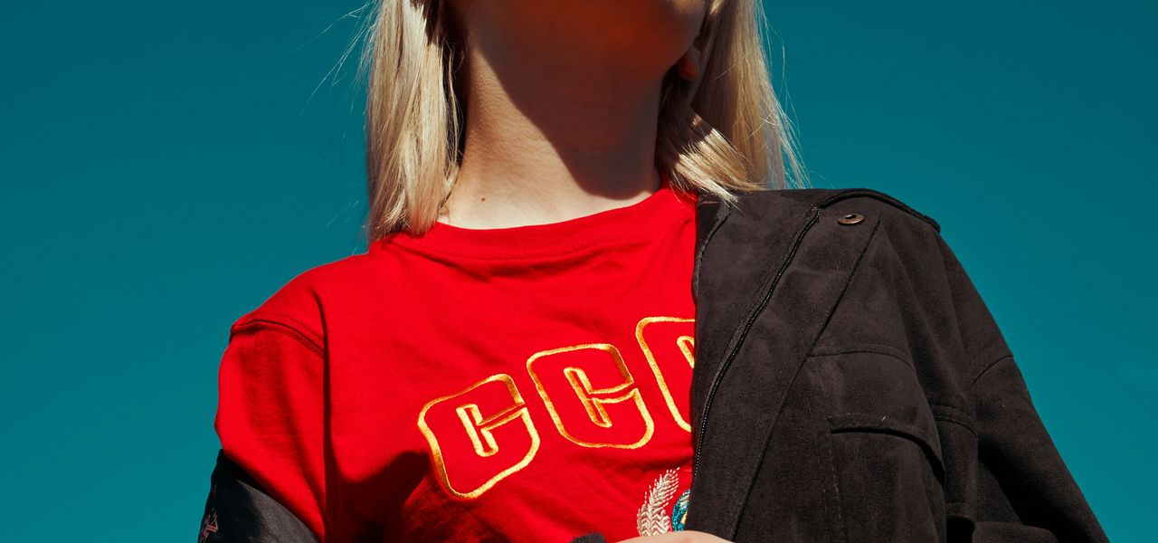 woman with sunglasses standing outdoor during daytime