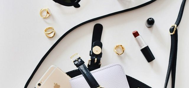 women's sunglasses and black bag with watch and iPhone 6