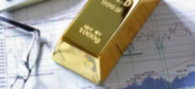 Preço do ouro: foco está na decisão da taxa de juros do Fed e preocupações com recessão