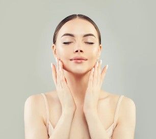 Model with glowing skin, representing Glam Dust vegan beauty