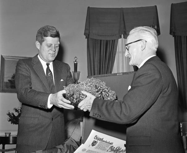 President John F Kennedy receives a bowl of shamrock