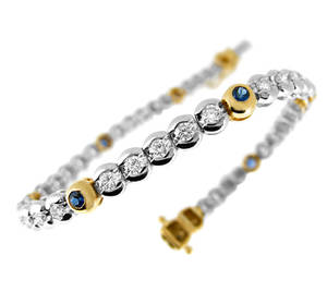 Sapphire and diamond rubover set line bracelet in 18 ct yellow/white gold