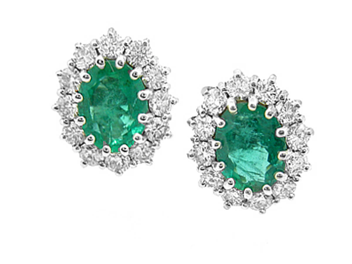 DE2782&nbsp;Oval emerald(2X1.12ct) 2.24 ct and diamond(2X12x5ct) 1.22 ct 18 carat white gold cluster&nbsp;stud earrings.