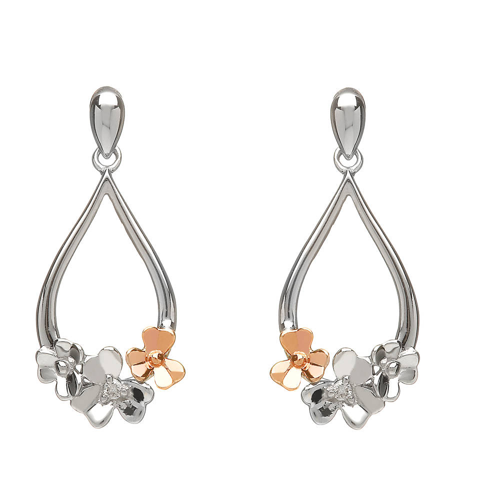 diamond set 9 carat white gold love shamrock posy earrings with one rare Irish rose gold flower.