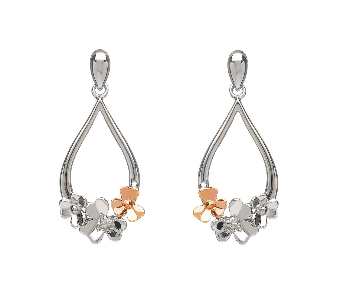 diamond set 9 carat white gold love shamrock posy earrings with one rare Irish rose gold flower.