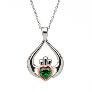 silver and rare Irish rose gold Claddagh pendant with green stone