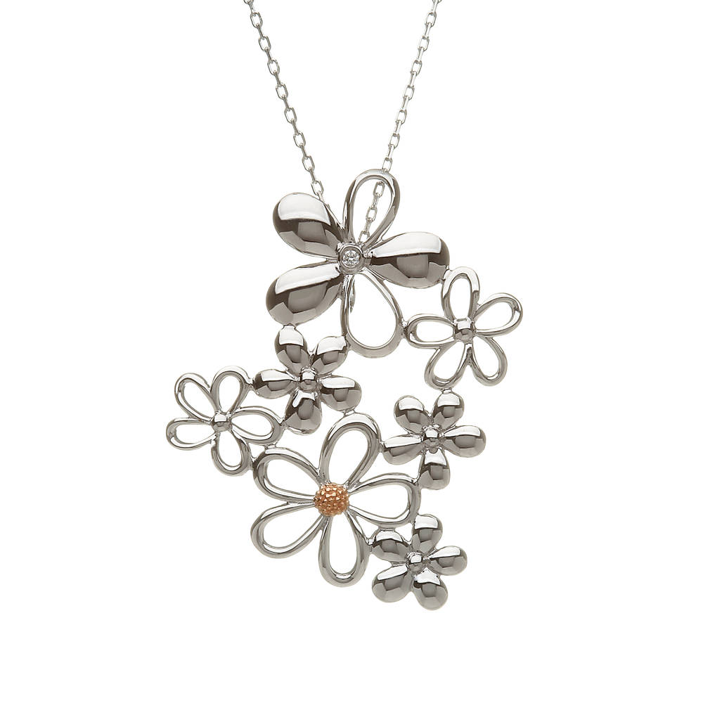 Diamond set sterling silver and rose goldcluster petal pendant with rare Irish gold centre