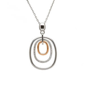 silver and rare Irish rose gold oval drop pendant with czs