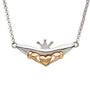 silver and rare Irish rose gold Claddagh pendant.