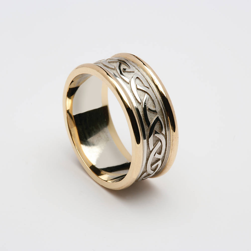 18 carat white gold man's&nbsp;Celtic love knot wedding ring with yellow gold rims.7mmVery beautiful