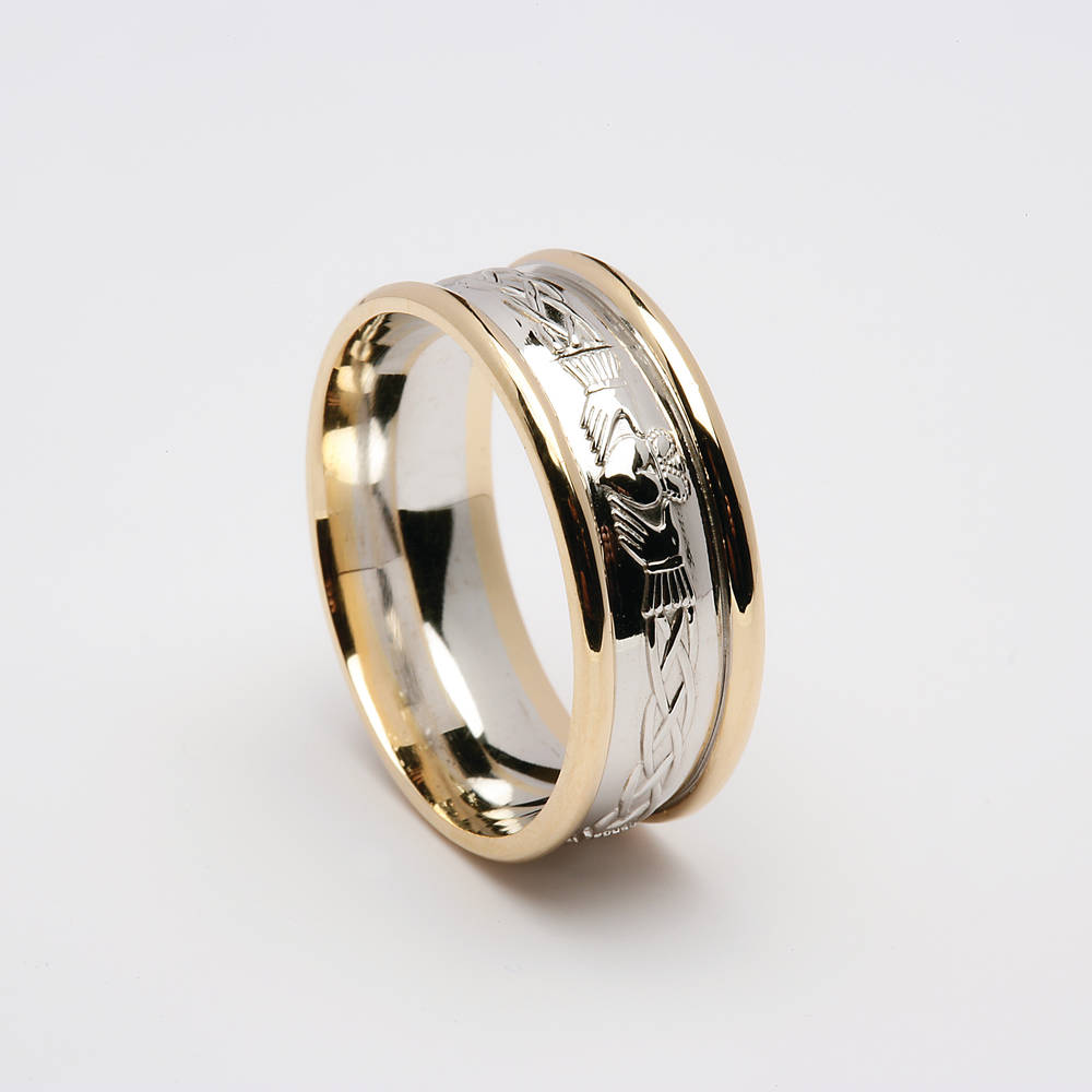 14 carat white gold man's Celtic Claddagh wedding ring with Heavy yellow gold rims.A very comfortable ring to wear and very beautiful. 8.7mm wide