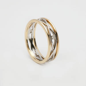 14 carat white gold lady's Celtic woven wedding ring with yellow gold rims and diamonds