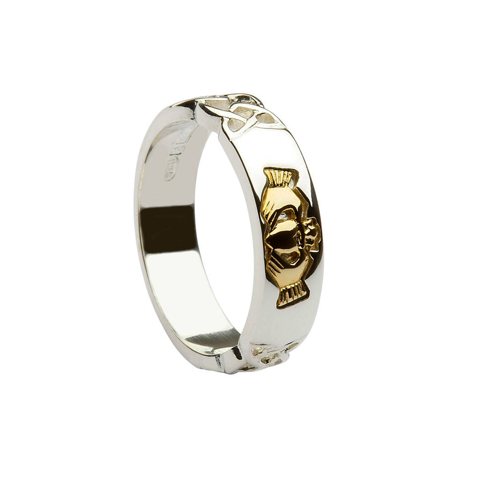 Silver ring with celtic knot shoulders and claddagh made of 14 carat gold.A most desirable ring.