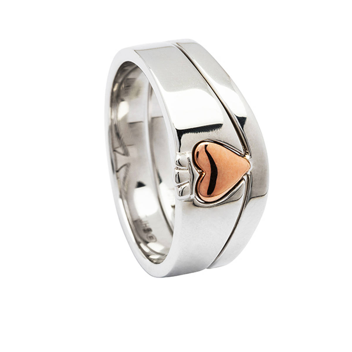 Two-piece interlocking sterling silver Claddagh ring with plated rose gold heart. 
Available in 10carat white gold with rose gold heart for 1400euro-contact us to arrange payment