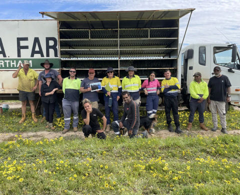 group of people in front of a truck