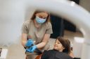 dentist-fitting-aligner