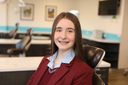 Teenage girl with braces smiling