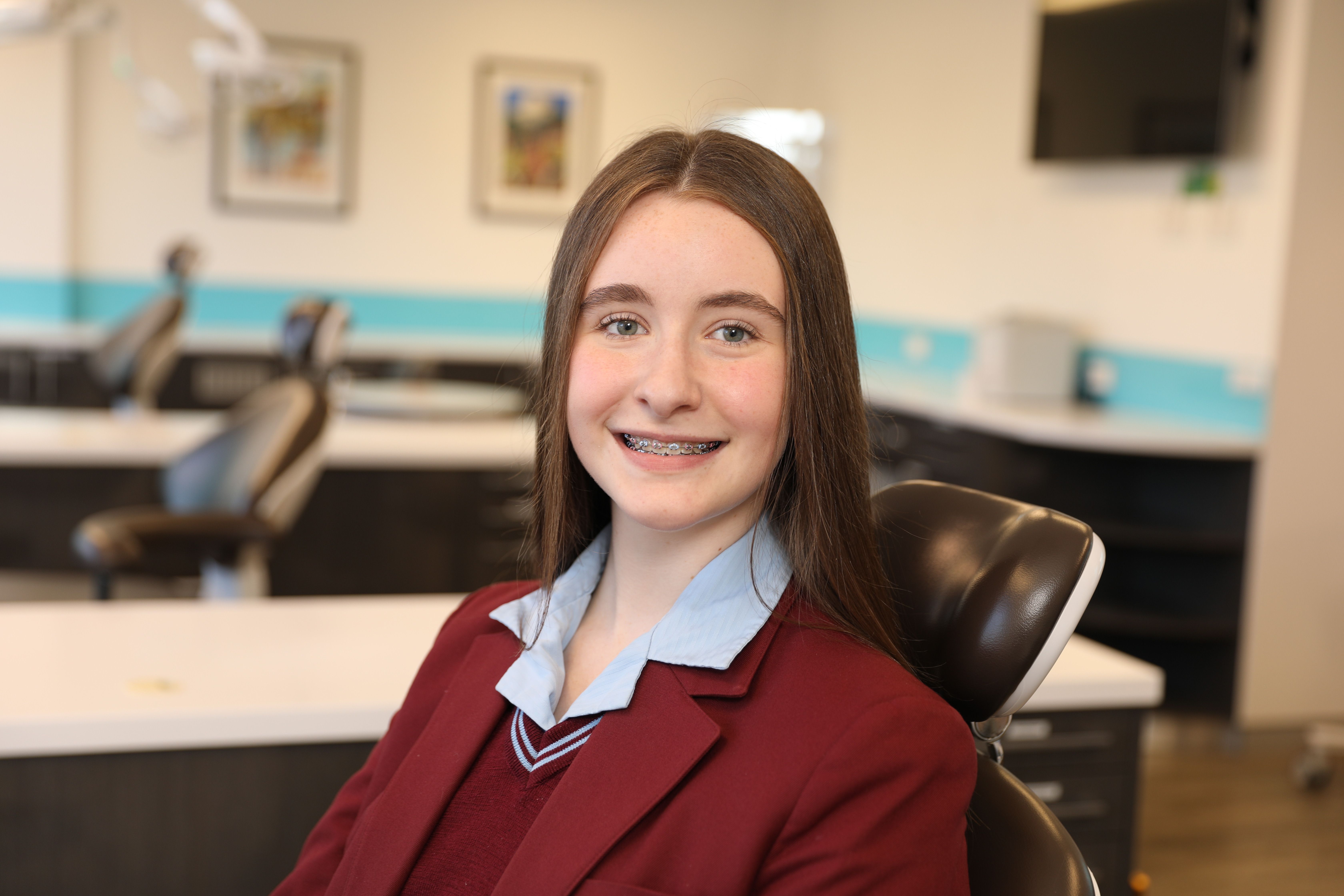 Teenage girl with braces smiling