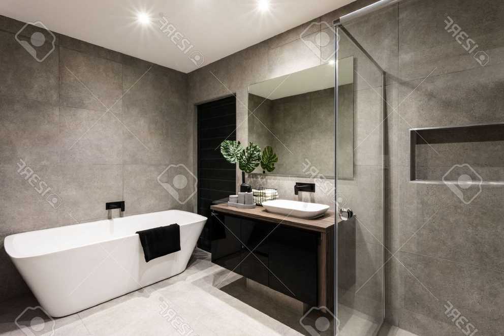 Modern Bathroom With A Shower Area And Bath Tub Including A Wall.. Within Popular Bathroom Wall Mirrors (Photo 19 of 20)