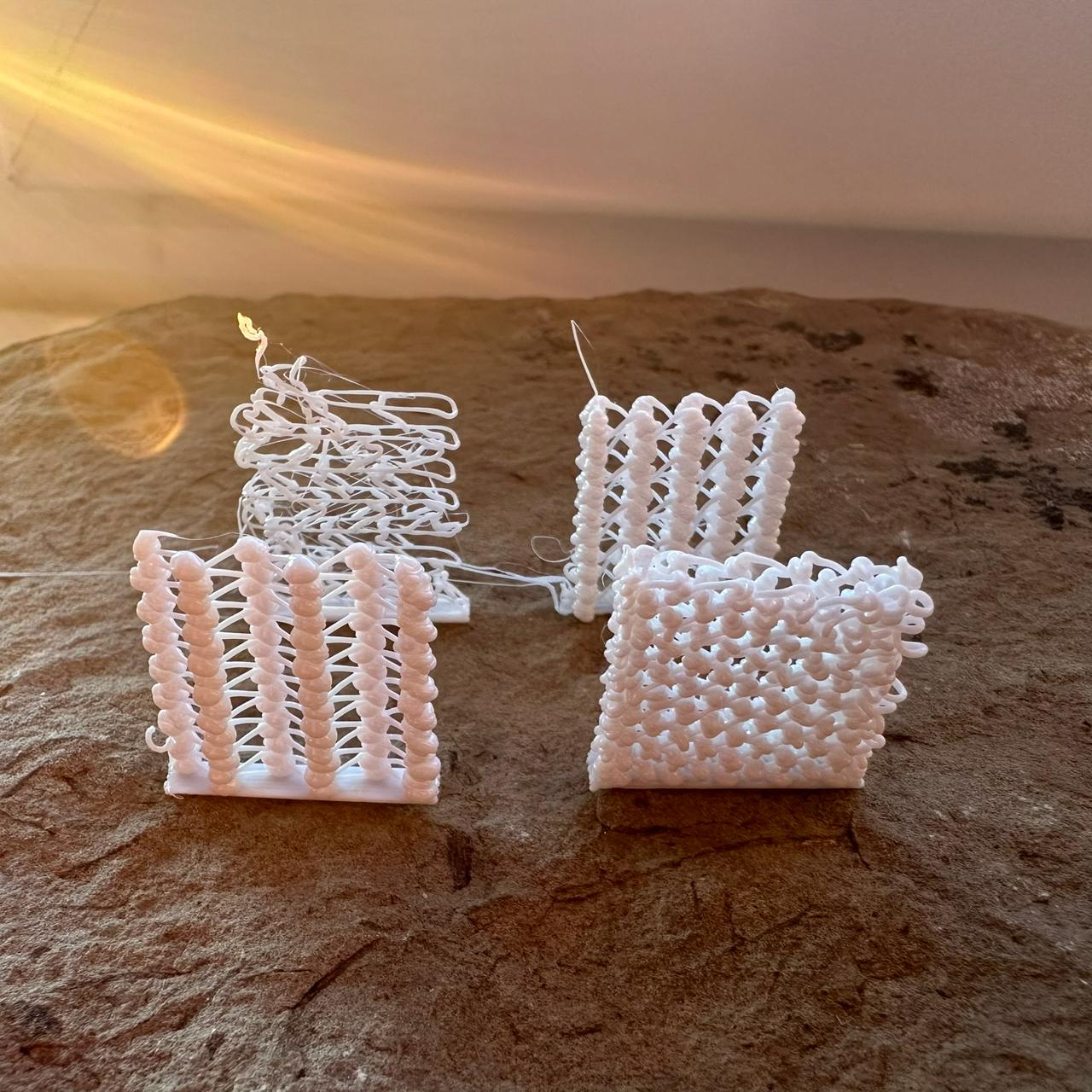Four experimental walls made of knots and strands, side view