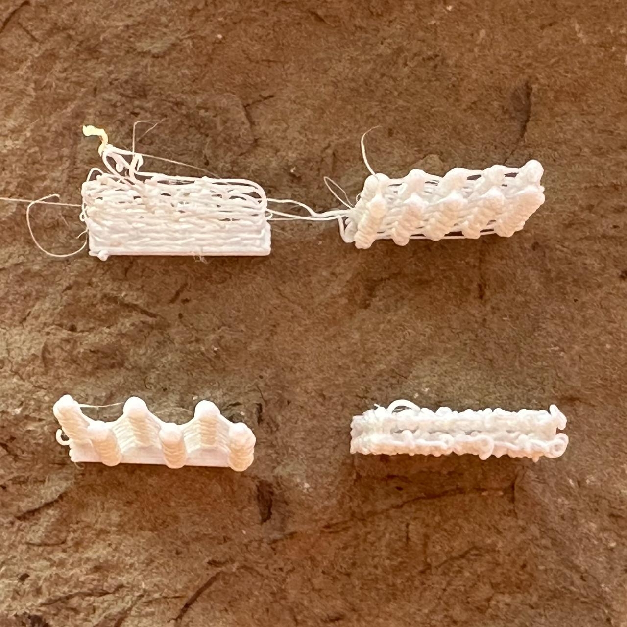Four experimental walls made of knots and strands, top view