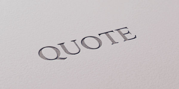 Electrician writing a detailed, no-obligation quote