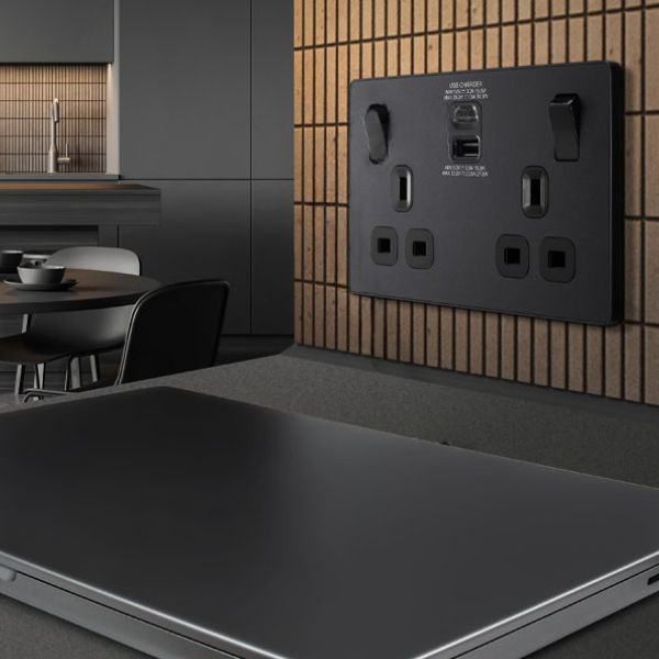 Modern wall socket with USB-C ports in use