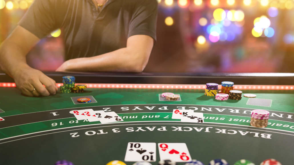 Close-up of blackjack cards on a casino table.