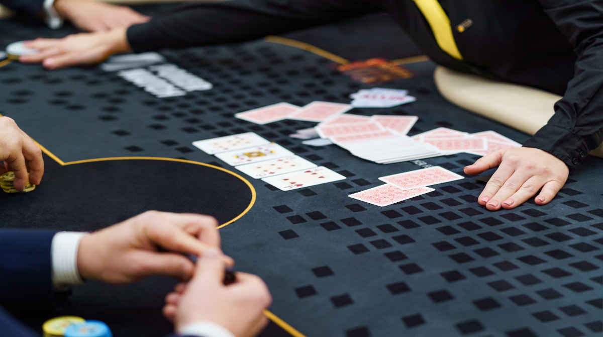A person walking away from a casino gaming table.