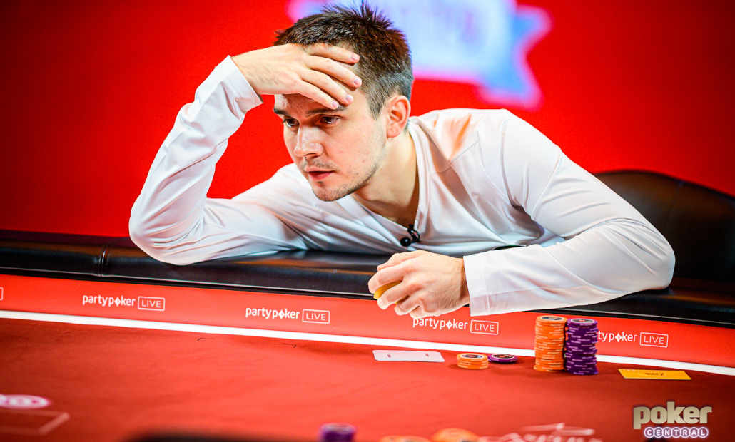 Mikita Bodyakovsky sitting at a poker table.