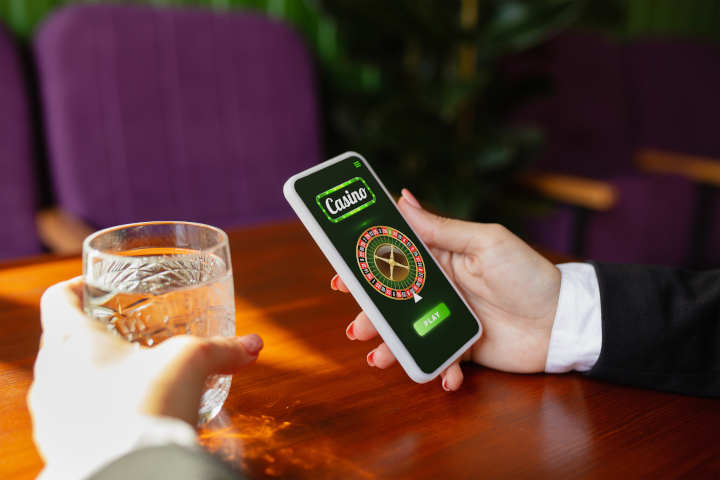 A person playing a live dealer casino game on their smartphone.