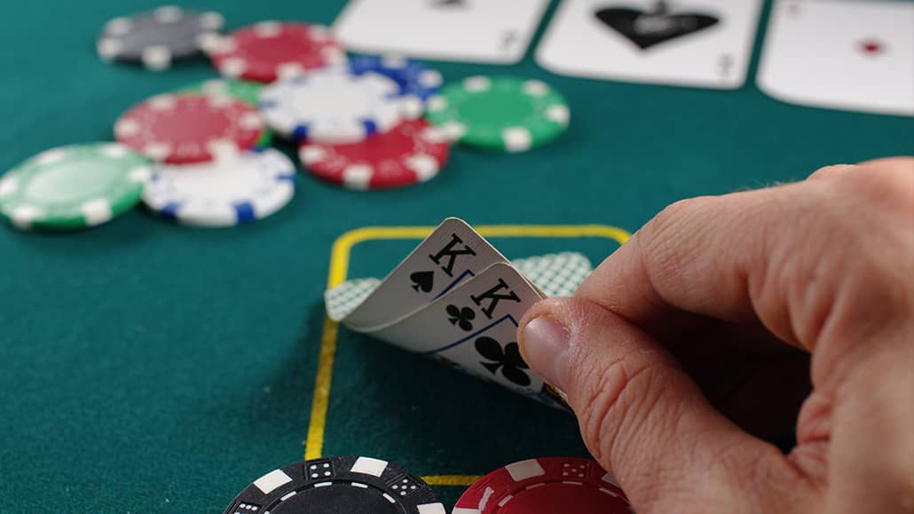 A poker table setup with chips and cards.