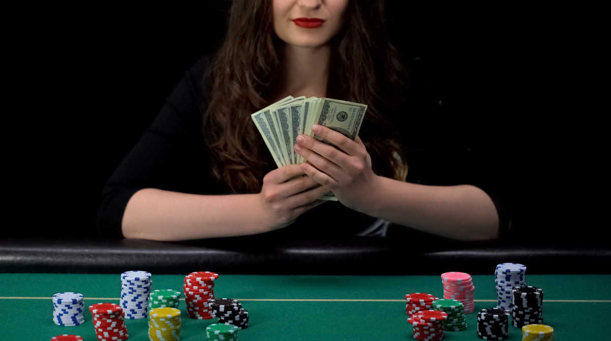 Casino chips and cash on a table, illustrating the concept of setting a budget.