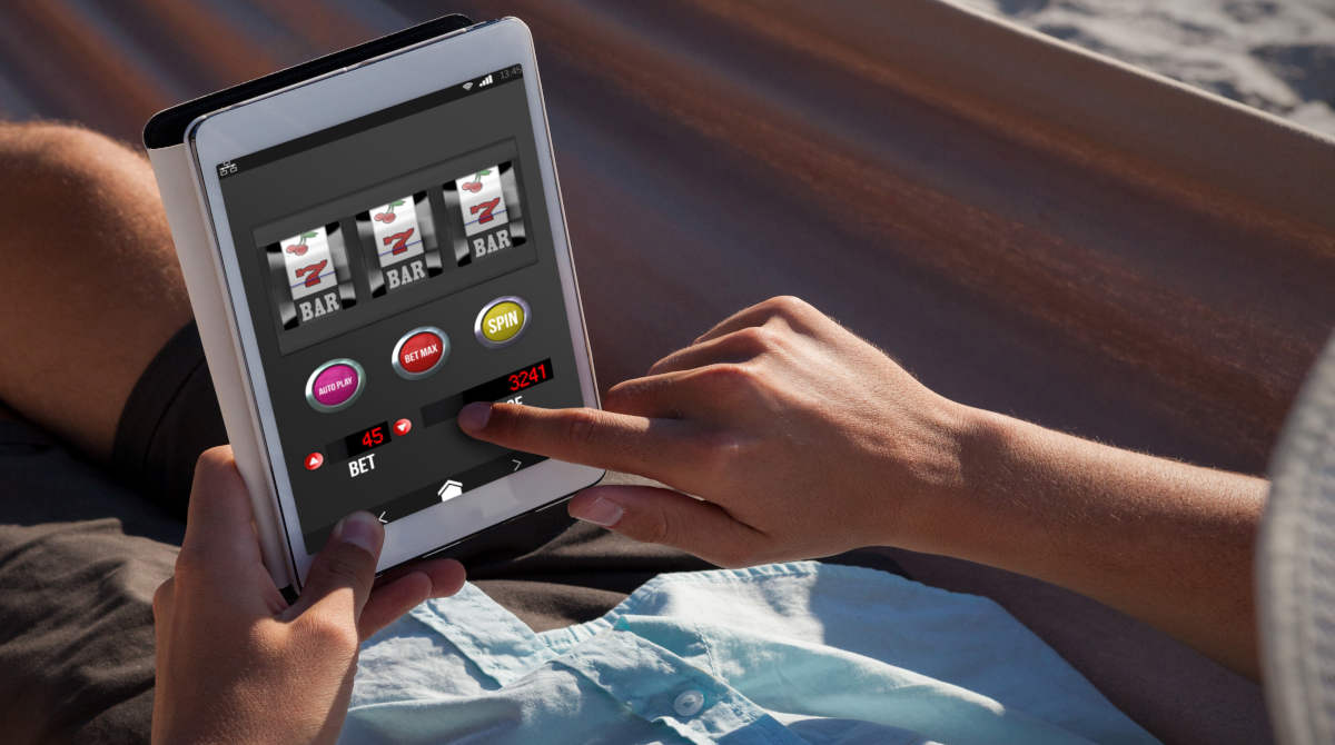 A person playing online slots on their smartphone.