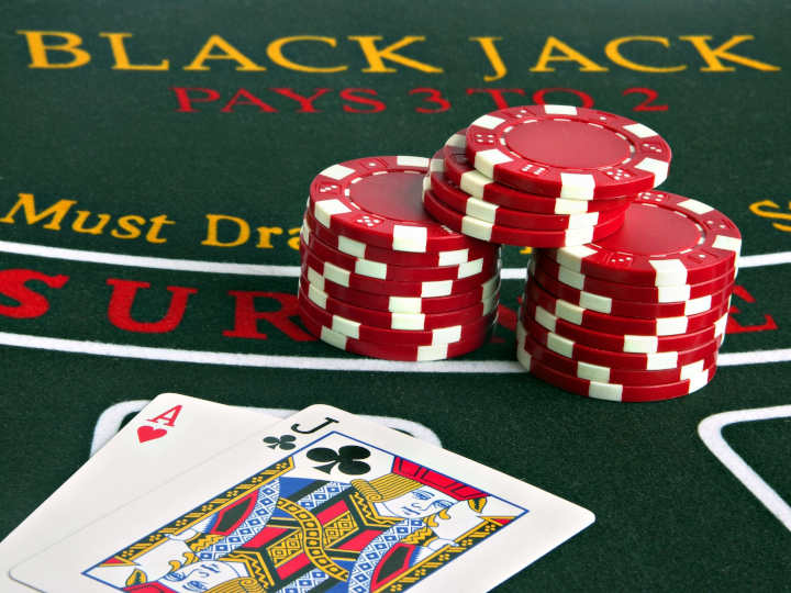 Chips and cards on a blackjack table illustrating the double down concept.