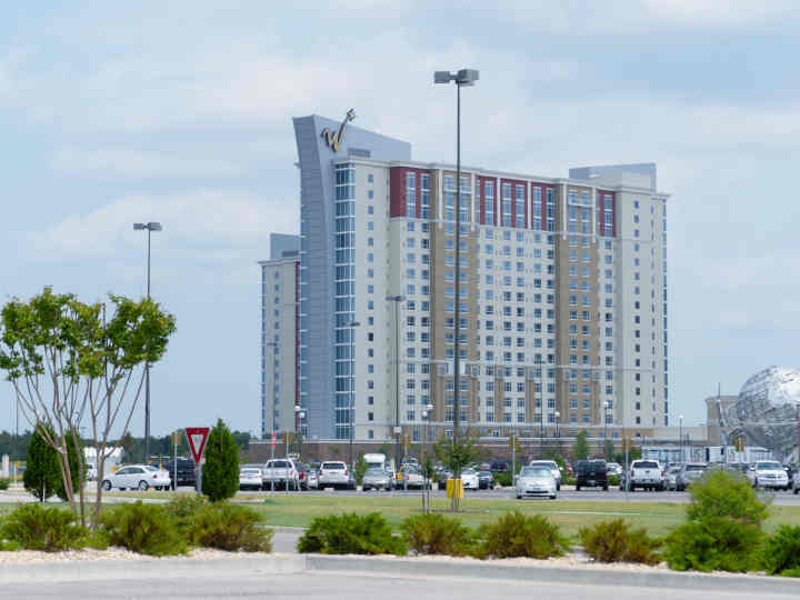 The exterior of the WinStar World Casino hotel towers at dusk.