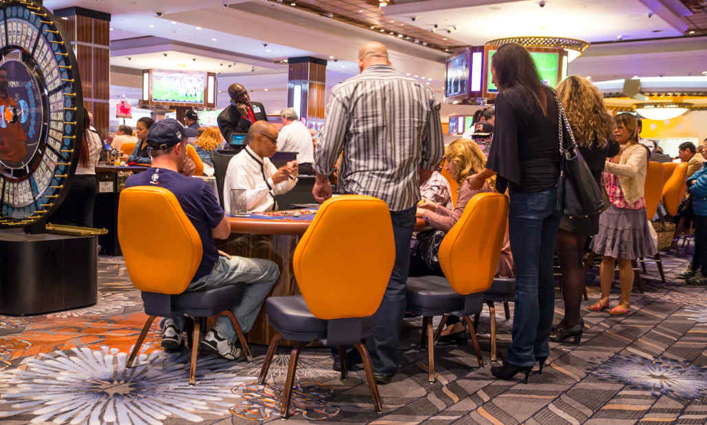 A brightly lit Indian casino floor with slot machines