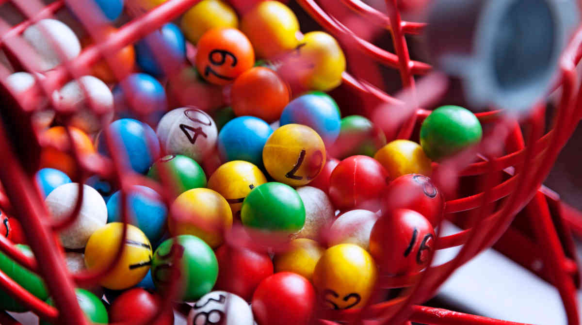Person using a laptop to play online bingo.