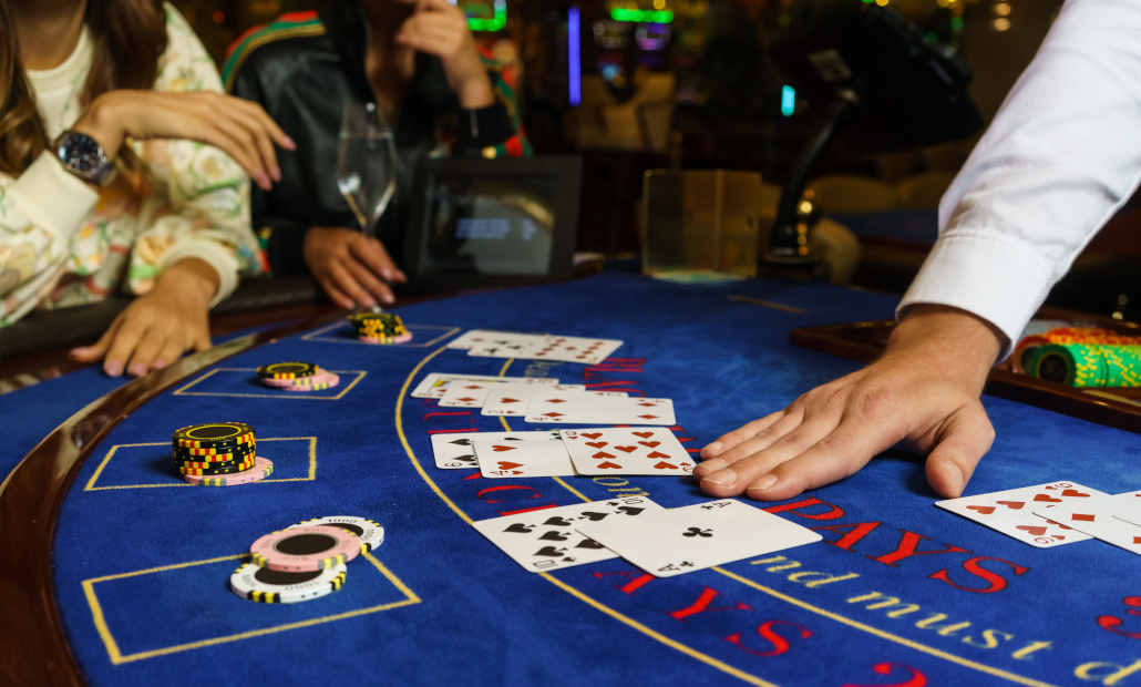 A stack of casino chips on a blackjack table.