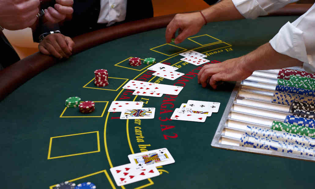 A live dealer at an online blackjack table.