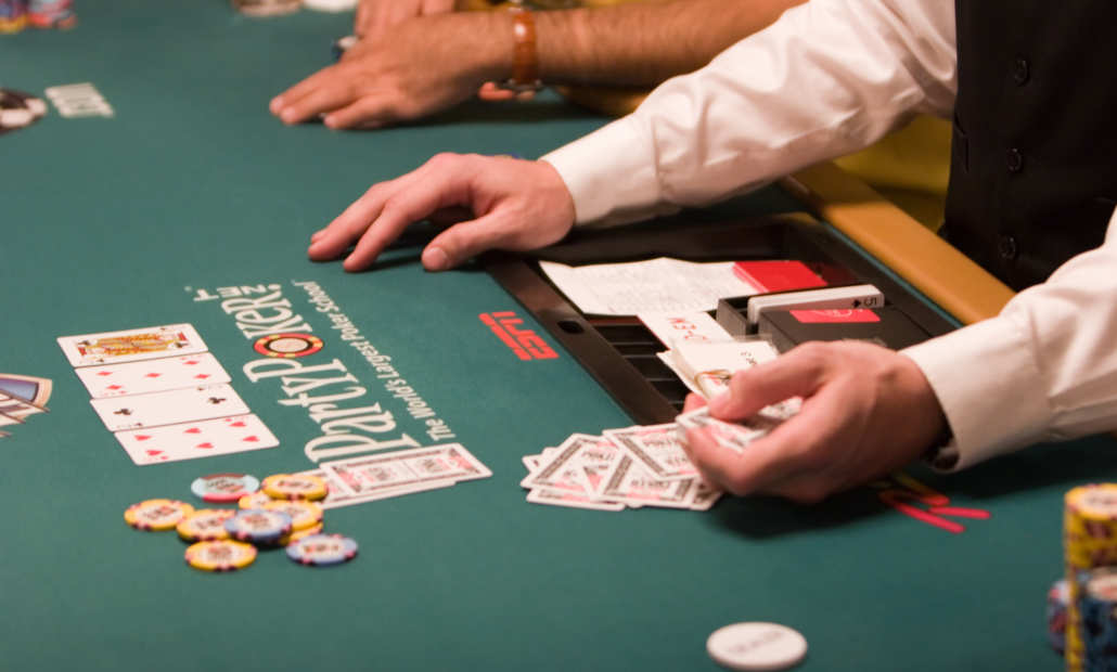 A player considering a bluff on a scary-looking poker board