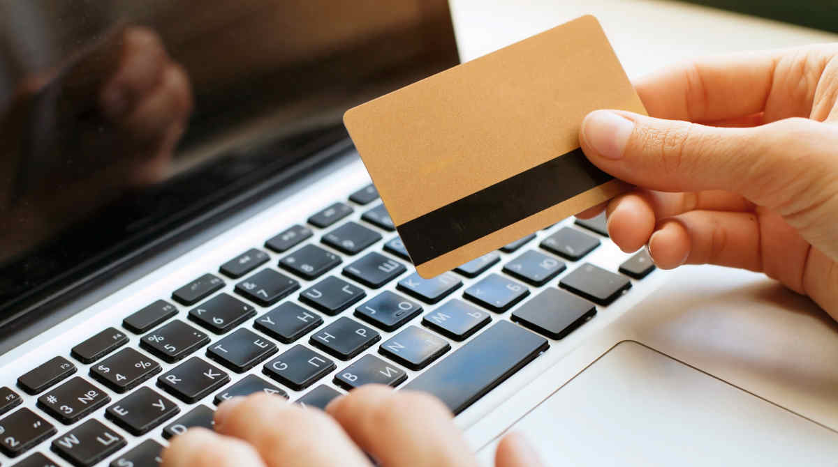 Person using a laptop for easy casino deposit options