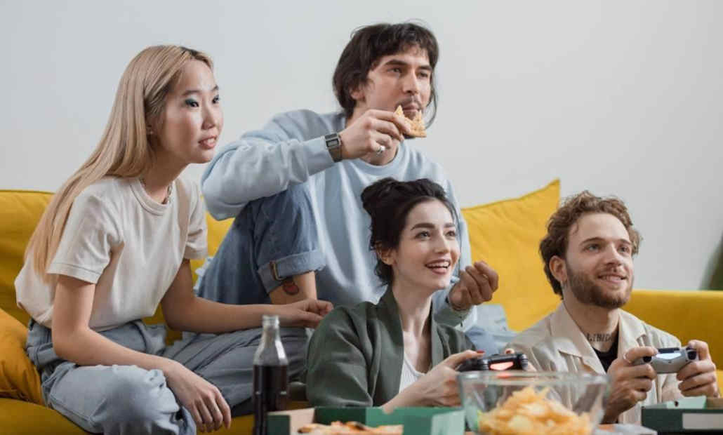 A person smiling and enjoying video games responsibly.