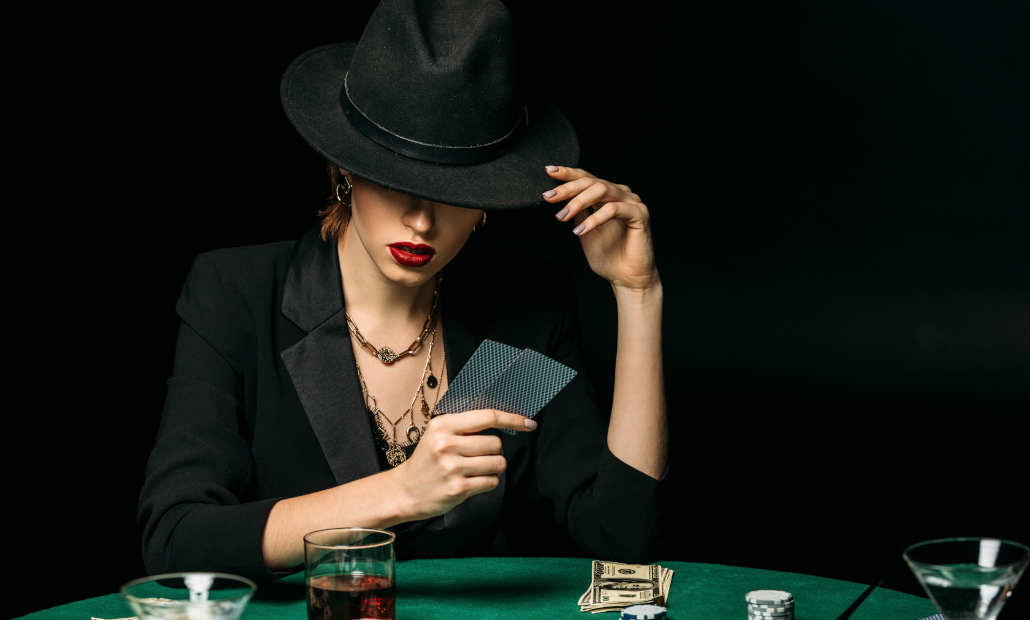 A person calmly considering their next move in a casino game.