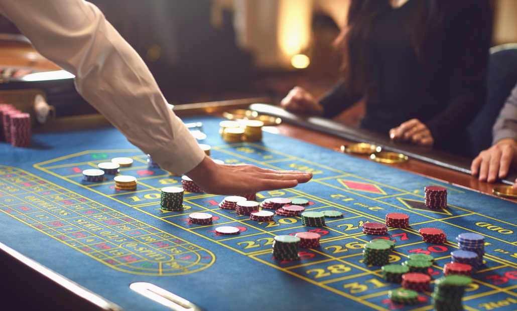 Casino chips and dice on a gaming table.